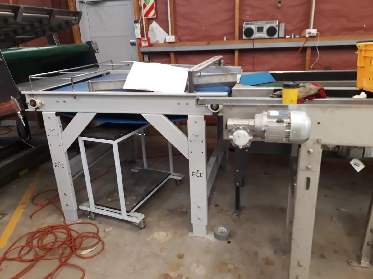 Bench-mounted conveyor section ready for installation