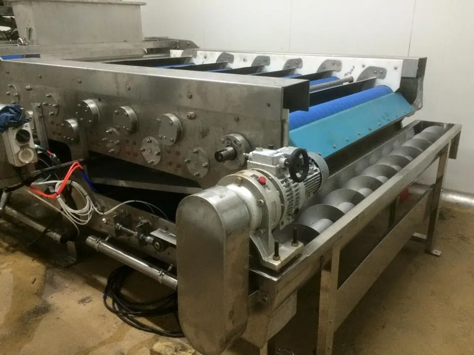 Drive rollers and belt tracking hardware on a conveyor assembly