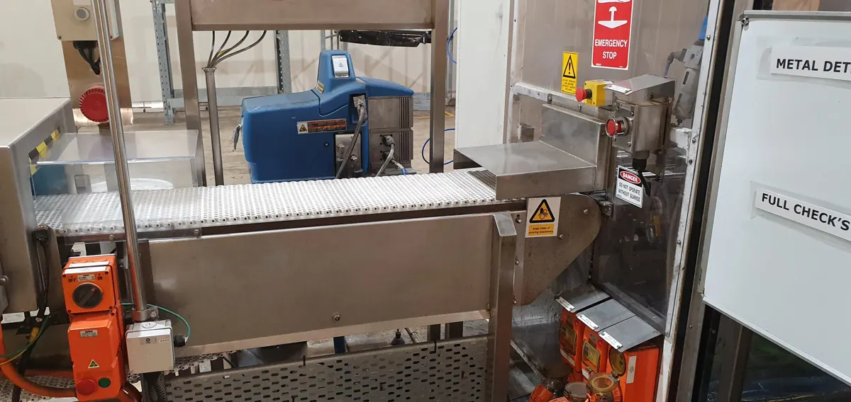 Conveyor line with metal detector and repair access